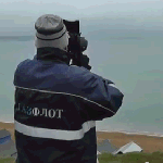 Dick watching Snoopy through his telescope